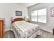 Bright bedroom with a double bed and ample natural light at 8825 Chapel Grove Crossing Dr, Huntersville, NC 28078