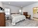 Spacious bedroom with carpeted floor and ensuite bathroom at 8825 Chapel Grove Crossing Dr, Huntersville, NC 28078