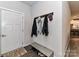 Inviting entryway with coat rack and bench for shoes at 8825 Chapel Grove Crossing Dr, Huntersville, NC 28078