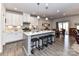 Spacious kitchen with white cabinets and a large island at 8825 Chapel Grove Crossing Dr, Huntersville, NC 28078