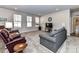 Relaxing living room with comfortable seating and a large TV at 8825 Chapel Grove Crossing Dr, Huntersville, NC 28078