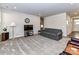 Cozy living room featuring gray sofa and carpet at 8825 Chapel Grove Crossing Dr, Huntersville, NC 28078