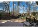 Private backyard with a deck, gazebo, and wooded area at 900 Cithara Dr, Matthews, NC 28105