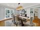 Bright dining room with hardwood floors and large windows at 900 Cithara Dr, Matthews, NC 28105