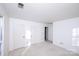 Well-lit bedroom with double closets and neutral carpeting at 9501 Whitethorn Dr, Charlotte, NC 28277