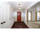 Bright entryway with hardwood floors and a wooden door at 9501 Whitethorn Dr, Charlotte, NC 28277