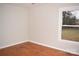 Simple bedroom featuring hardwood floors and a window at 9737 Feldbank Dr # 7, Charlotte, NC 28216