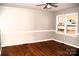 Hardwood floor living room with ceiling fan at 9737 Feldbank Dr # 7, Charlotte, NC 28216