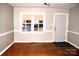 Living room with hardwood floors and neutral-toned walls at 9737 Feldbank Dr # 7, Charlotte, NC 28216