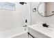 Modern bathroom with white tile, soaking tub, and black matte fixtures at 1105 Stanback Rd, Chester, SC 29706