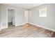 Spacious bedroom with vinyl flooring and access to other rooms at 1105 Stanback Rd, Chester, SC 29706