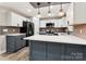 Modern kitchen featuring white and gray cabinets, quartz countertops, and stainless steel appliances at 1105 Stanback Rd, Chester, SC 29706