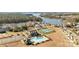 Aerial view showing community pool, tennis courts, and lake at 11058 Argosy Dr, Lancaster, SC 29720