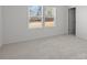 Simple bedroom with neutral colored carpet and large windows at 11058 Argosy Dr, Lancaster, SC 29720