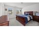 Bedroom with carpeted floor, large windows, and wooden furniture at 11058 Argosy Dr, Lancaster, SC 29720