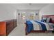 Main bedroom with carpeted floor, large windows, and a wooden dresser at 11058 Argosy Dr, Lancaster, SC 29720