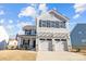 Two-story house with gray siding, two-car garage, and a small front porch at 11058 Argosy Dr, Lancaster, SC 29720