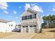 Two-story house with gray siding, two-car garage, and a small front porch at 11058 Argosy Dr, Lancaster, SC 29720