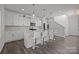 Modern kitchen with white cabinets, island, and stainless steel appliances at 11058 Argosy Dr, Lancaster, SC 29720
