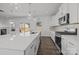Modern kitchen with white cabinets, large island, and stainless steel appliances at 11058 Argosy Dr, Lancaster, SC 29720