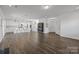 Open living room and kitchen with hardwood floors and island at 11058 Argosy Dr, Lancaster, SC 29720