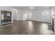 Living room with hardwood floors, fireplace and large windows at 11058 Argosy Dr, Lancaster, SC 29720