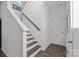 Modern staircase with gray railing and dark hardwood steps at 11058 Argosy Dr, Lancaster, SC 29720