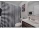 Bathroom with checkered shower curtain and vanity at 12531 Gotland Rd, Midland, NC 28107