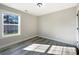 Well-lit bedroom with hardwood floors and window at 1324 Crawford Rd # 6, Rock Hill, SC 29730
