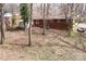 This shot presents the home's backyard and surrounding lot at 1418 Nottingham Rd, Kannapolis, NC 28081