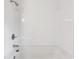Pristine white bathtub with showerhead and tiled walls, perfect for relaxation at 1418 Nottingham Rd, Kannapolis, NC 28081