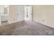 Bedroom features carpeted floors, neutral paint and access to the bathroom at 1418 Nottingham Rd, Kannapolis, NC 28081