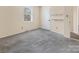 Cozy bedroom featuring neutral walls, carpet, and a window allowing natural light at 1418 Nottingham Rd, Kannapolis, NC 28081