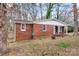 Cozy brick home featuring a well-maintained lawn and traditional design at 1418 Nottingham Rd, Kannapolis, NC 28081