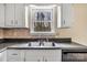 Functional kitchen sink with white cabinets, offering ample counter space at 1418 Nottingham Rd, Kannapolis, NC 28081