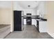 A bright kitchen features neutral countertops, white cabinets, and sleek appliances at 1418 Nottingham Rd, Kannapolis, NC 28081