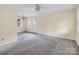 Spacious living room features neutral paint and trim, a window, and a ceiling fan at 1418 Nottingham Rd, Kannapolis, NC 28081
