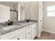 Bathroom boasts double vanity with granite countertop, and a shower at 150 Adams Tree Way, Troutman, NC 28166