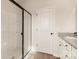 Modern bathroom with a large glass shower and white vanity at 150 Adams Tree Way, Troutman, NC 28166