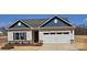 Charming single-story home features a white garage door, complementary paint colors, and manicured landscaping at 150 Adams Tree Way, Troutman, NC 28166