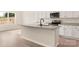 Kitchen island with granite countertop and sink, offering extra prep space at 150 Adams Tree Way, Troutman, NC 28166