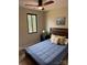 This bedroom has hardwood floors, a ceiling fan, and a window bringing in plenty of light at 150 Driftwood Dr, Mooresville, NC 28117