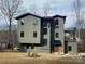 Modern two-story home featuring clean lines and expansive windows showcasing a contemporary design at 150 Driftwood Dr, Mooresville, NC 28117