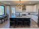 Modern kitchen featuring a large island with bar seating, sleek appliances, and natural light at 150 Driftwood Dr, Mooresville, NC 28117