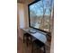 Charming kitchen with custom seating and granite countertop overlooking lake at 150 Driftwood Dr, Mooresville, NC 28117