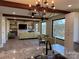 Bright, open living room with wood beams, a stone fireplace, and water views at 150 Driftwood Dr, Mooresville, NC 28117