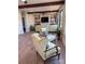 Spacious living room with wood beams, stone fireplace, and comfortable seating at 150 Driftwood Dr, Mooresville, NC 28117