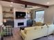 Inviting living room with stone fireplace, wood beams, and ample natural light at 150 Driftwood Dr, Mooresville, NC 28117