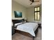 This main bedroom boasts a king bed, hardwood floors, and a large window at 150 Driftwood Dr, Mooresville, NC 28117