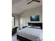 This main bedroom boasts a vaulted ceiling, ceiling fan, and hardwood flooring at 150 Driftwood Dr, Mooresville, NC 28117